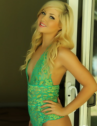 Blonde Cali babe Ashlie Madison shows off her tight perfect body in a sexy green lace onesie